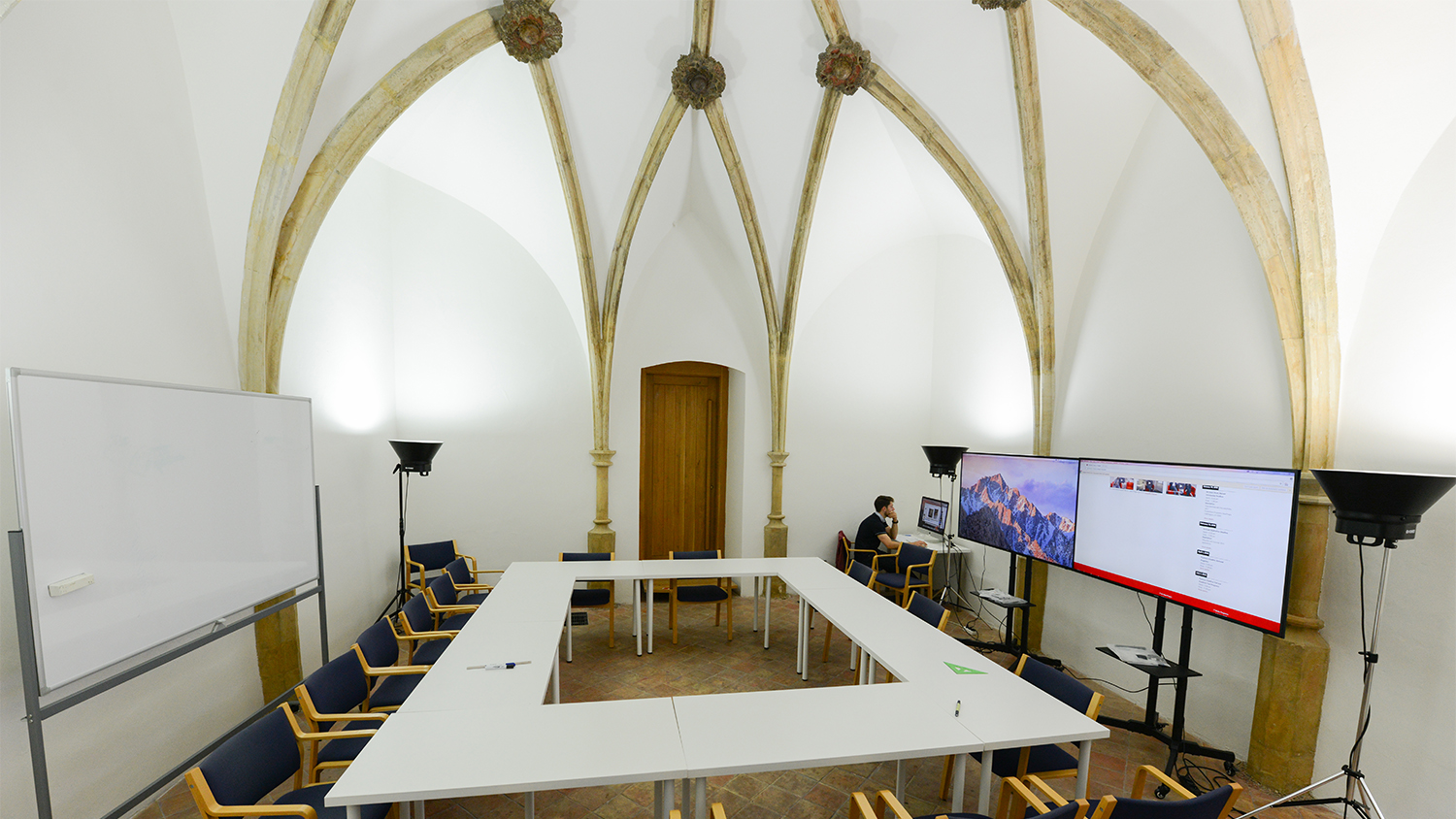 Classroom setting a historical space with gothic alcoves elements.