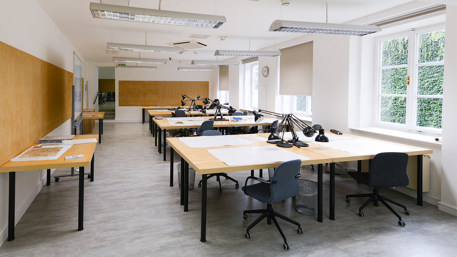 Studio space with large desks and lamps for design classes