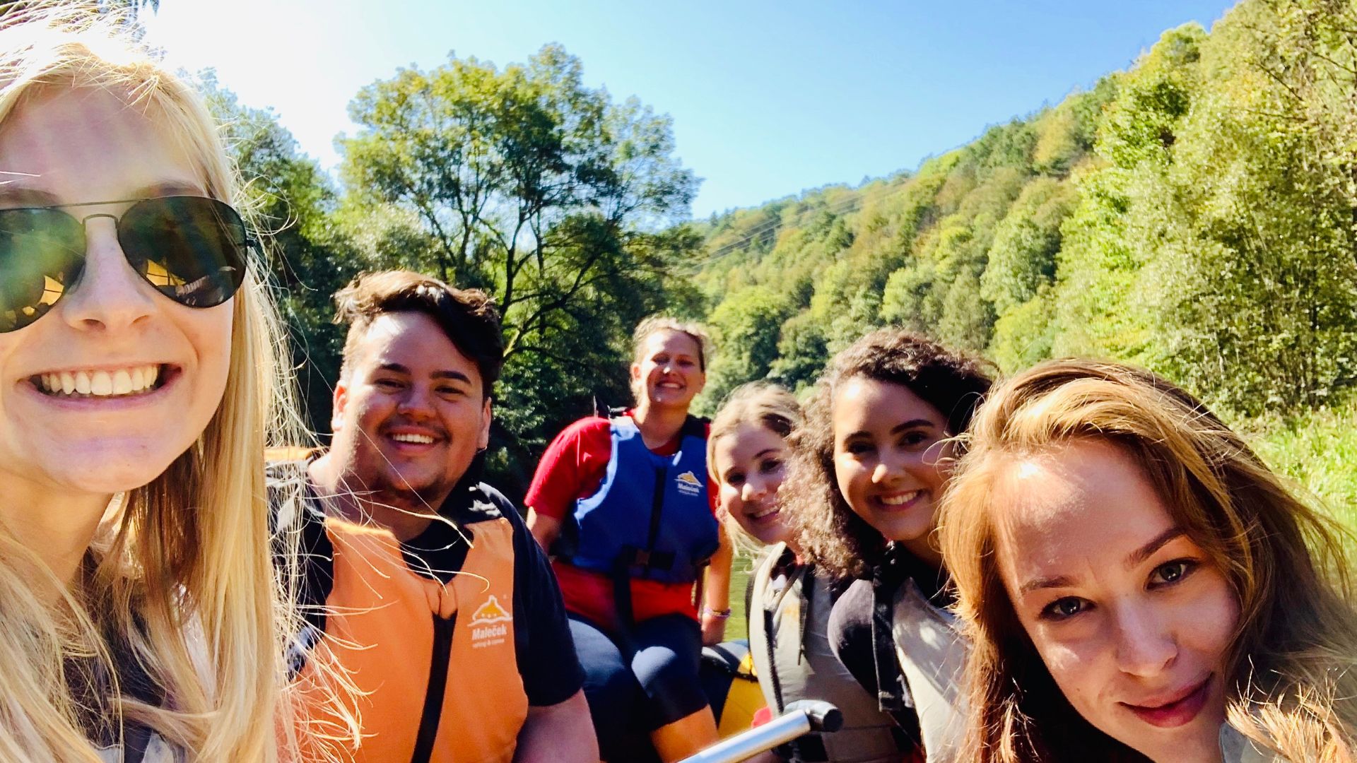 A group of students rafting