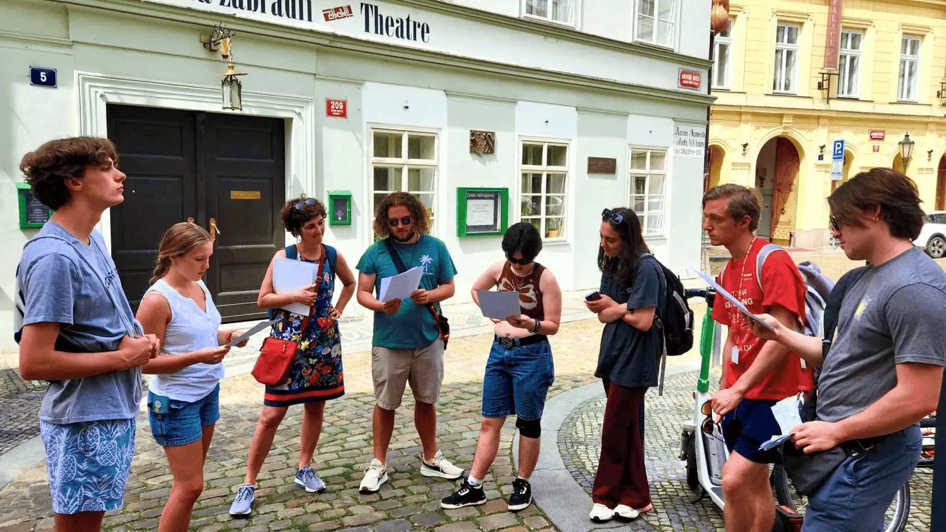 Group of students standing in the old streets of Prague.