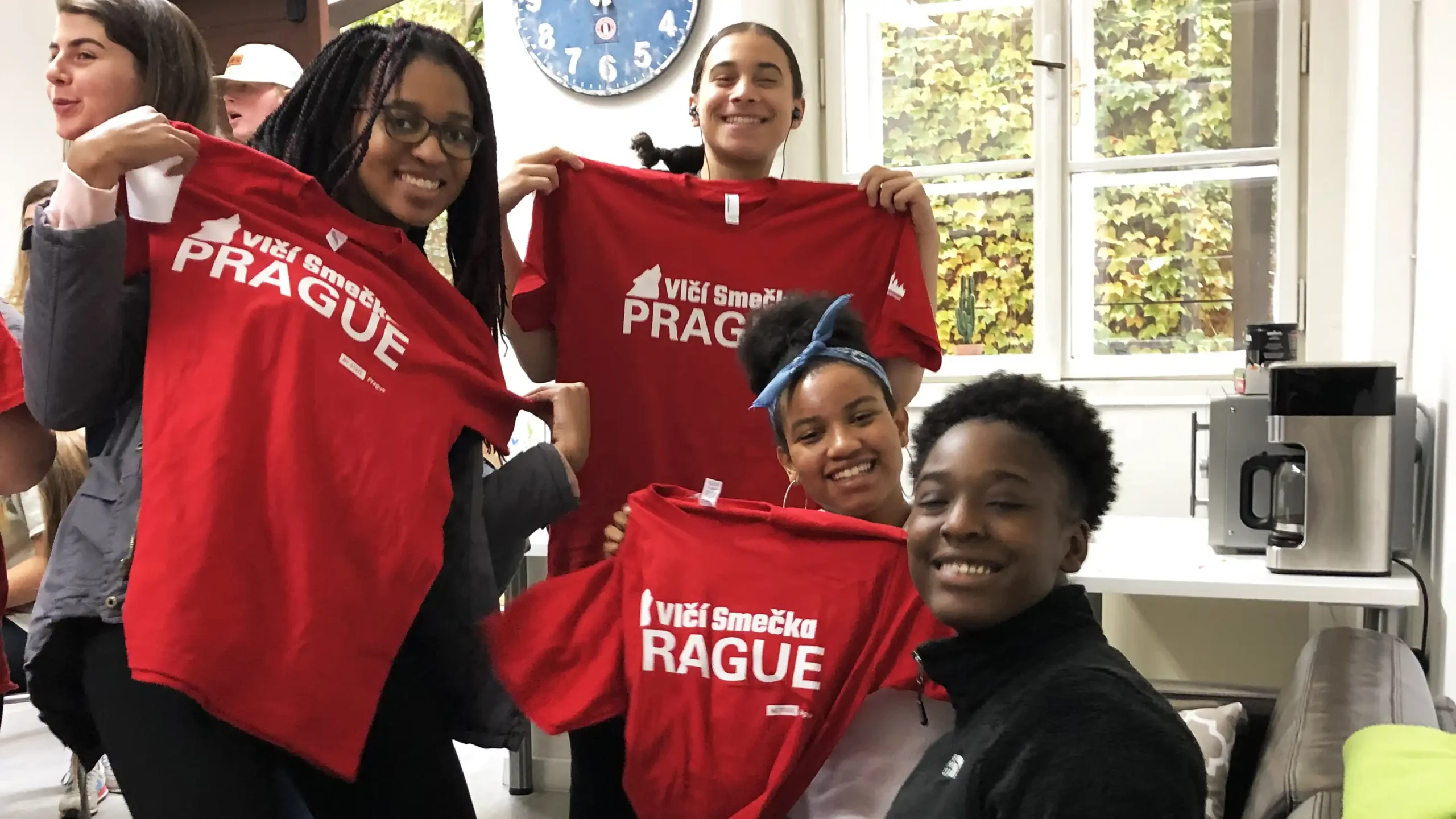 Connect Students Holding WolfPack T-Shirts