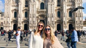 A student, Anastasia, in front of a church in Wien with her friend