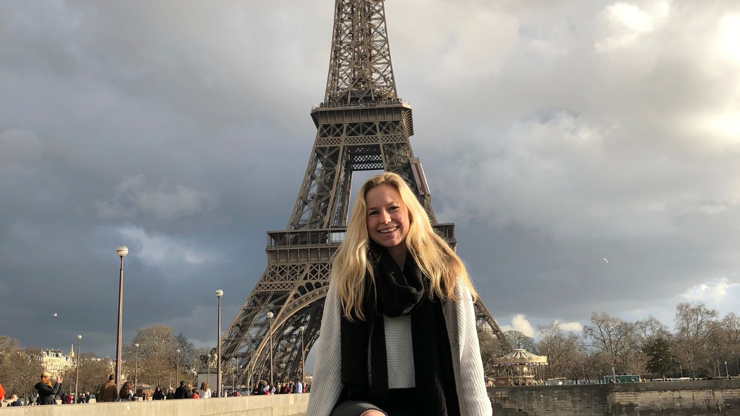 A student, Anastasia, in front of Eiffel Tower