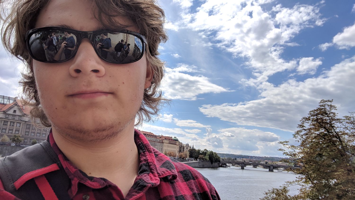 A student, Christopher, in Prague with Charles Bridge in the background