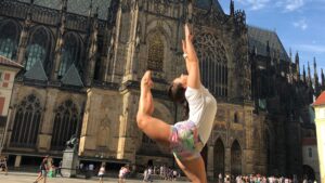 A student, Erica, jumping in front of St. Vitus Cathedral
