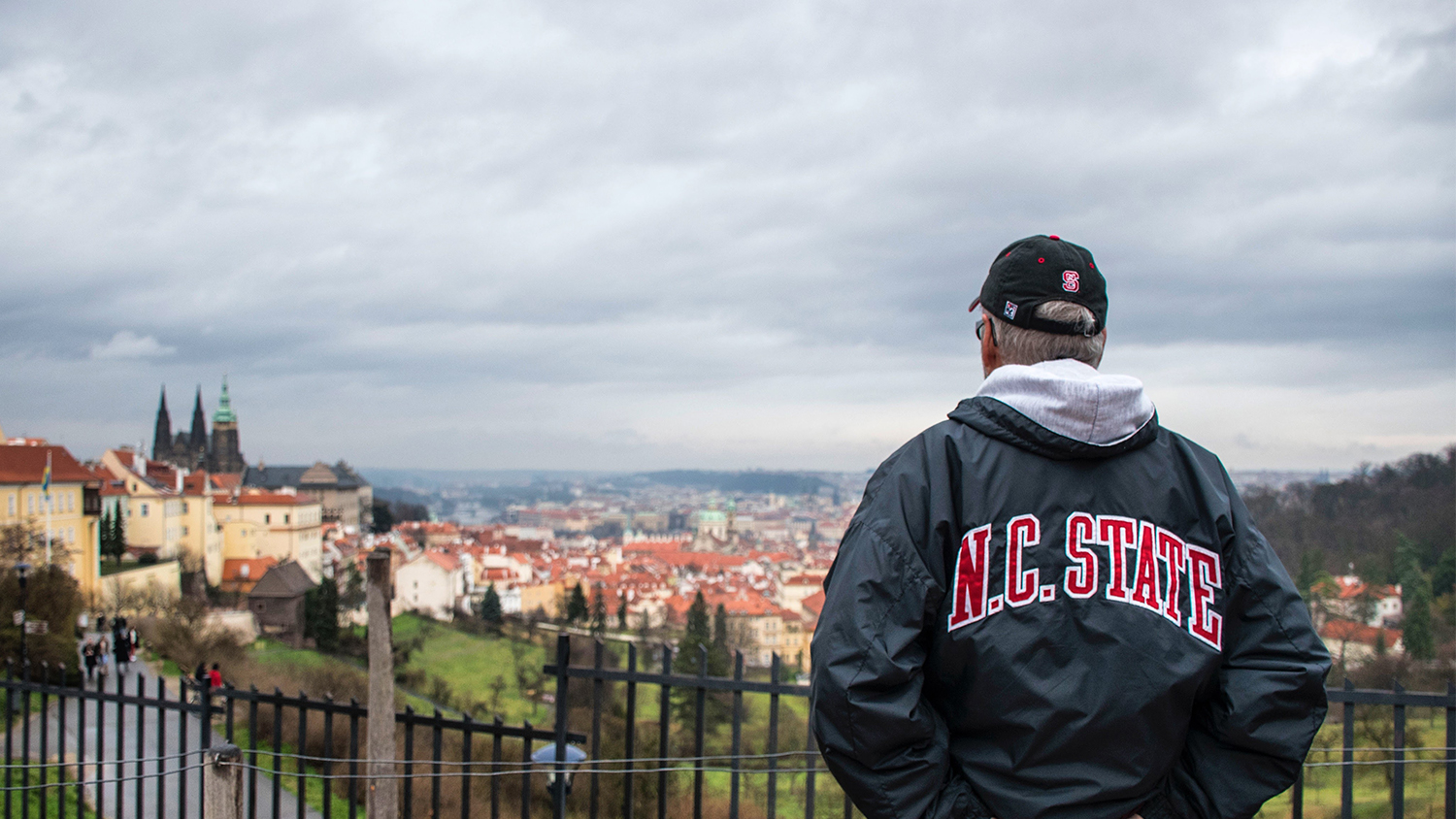 Alumni looking over Prague cityscape