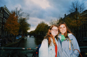 A student, Madeline, with her friend at a bridge in Amsterdam