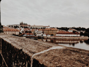 View of Prague Castle from a bridge near Vltava river.