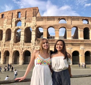 A student, Jenny, with her friend in front of Colosseum in Rome.