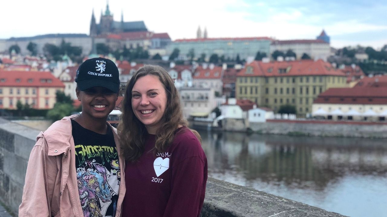 Two students on a study abroad program on the Prague's Charles Bridge