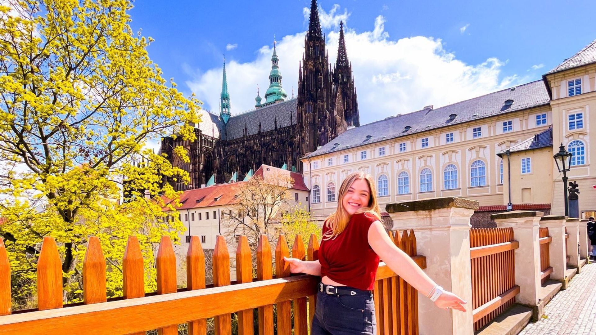Katie Gray taking a photo with St. Vitus Cathedral in the background