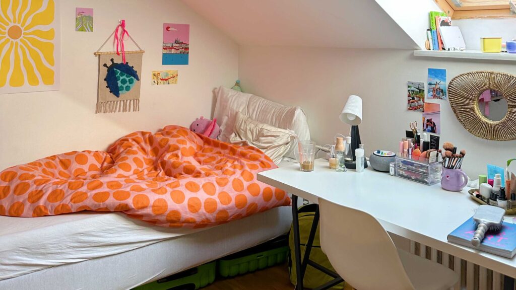 Atudent room in Prague with bed and desk and bright colors